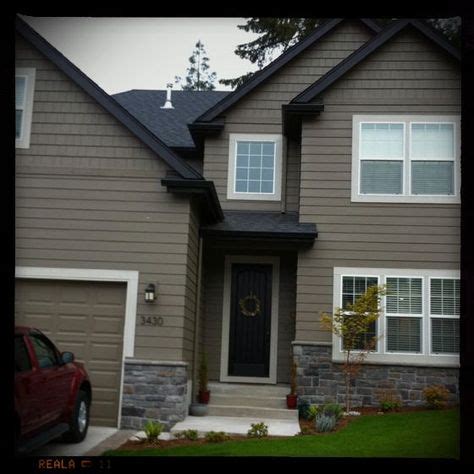 tan houses with black trim